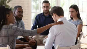 Group therapy session supporting stress management in addiction recovery