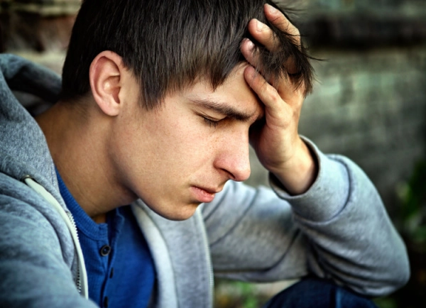 Individual experiencing distress and discomfort associated with DXM withdrawal symptoms and dextromethorphan dependence