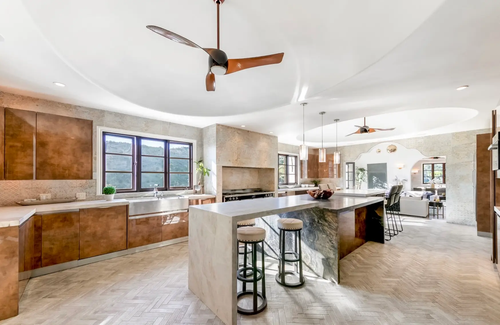 Spacious modern gourmet kitchen with marble island and natural light at a Los Angeles luxury mental health and wellness retreat