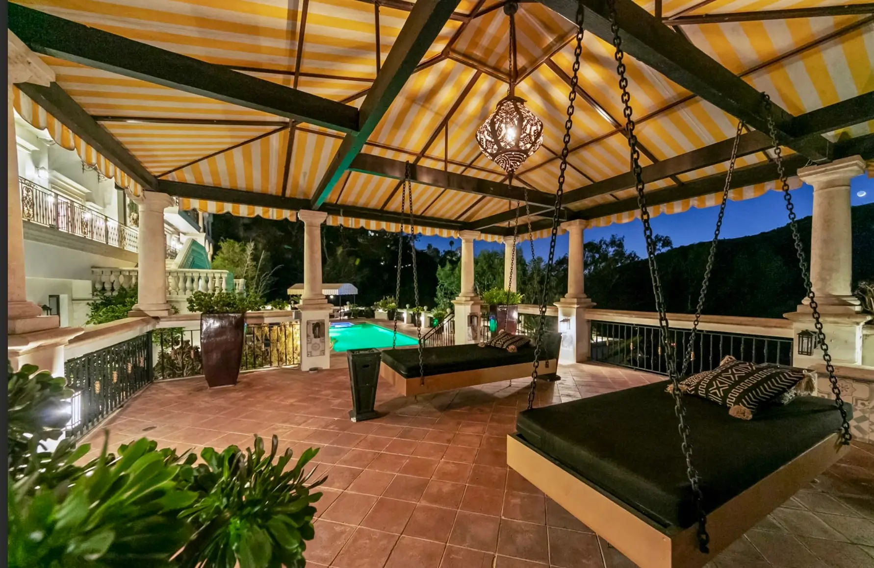 A serene outdoor courtyard features comfortable seating surrounded by lush palm trees and vibrant tropical landscaping, creating a peaceful environment ideal for clients on their recovery journey at a five stars recovery center. This tranquil space serves as a supportive setting for individual counseling and group discussions, fostering hope and connection among those seeking long-term recovery.