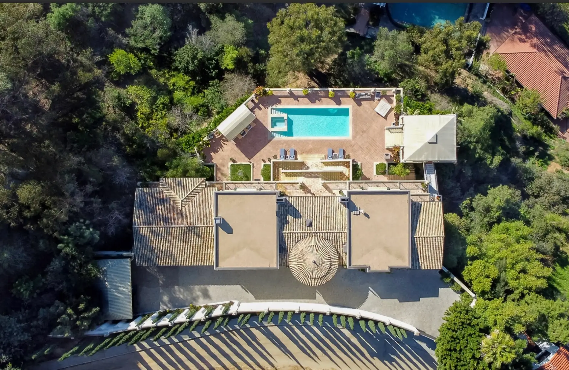 Aerial view of a luxury Los Angeles mental health and wellness retreat with private residence, swimming pool, and serene natural surroundings
